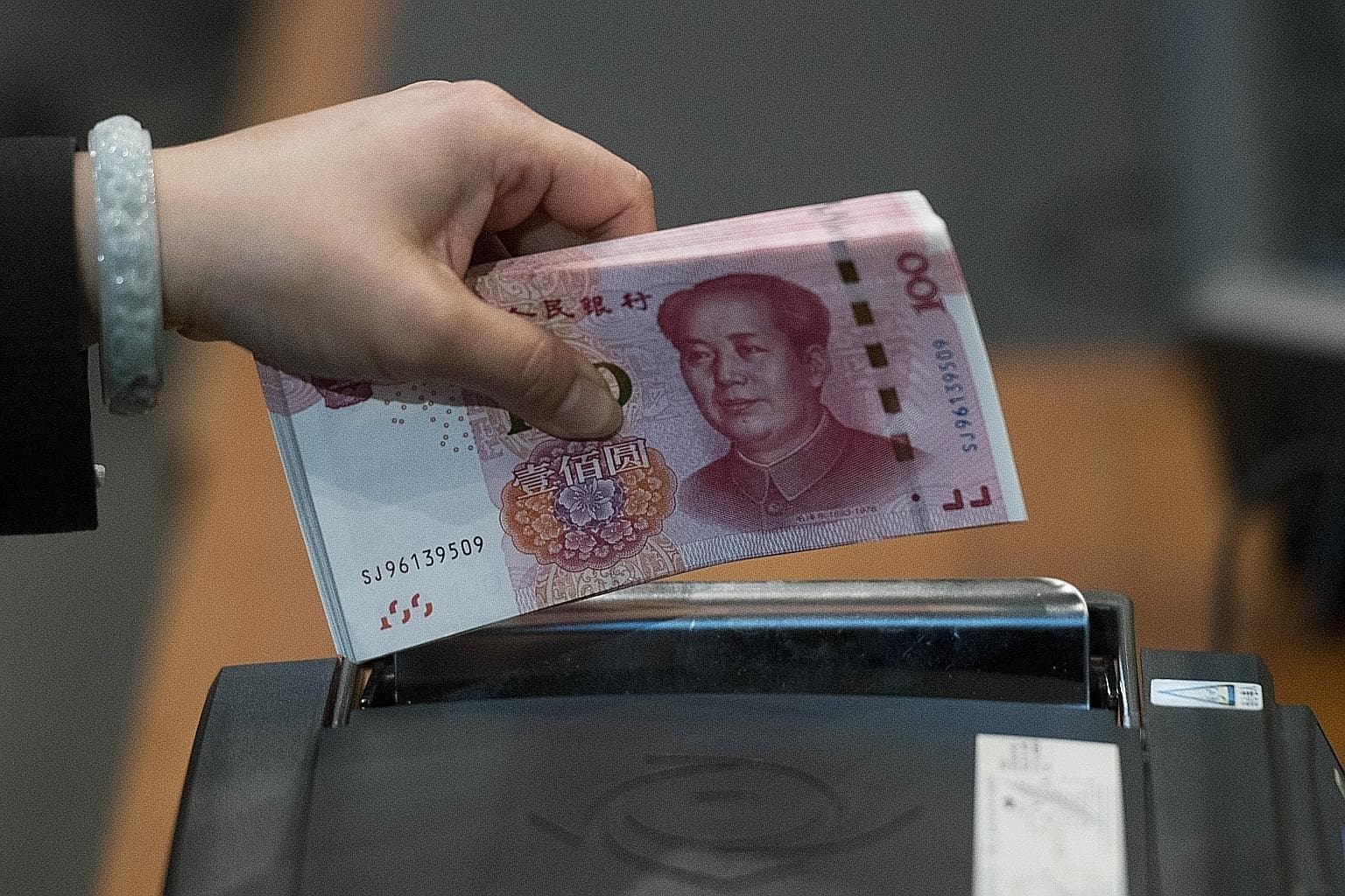 China launches 3,000 ATMs that convert electronic yuan to money
